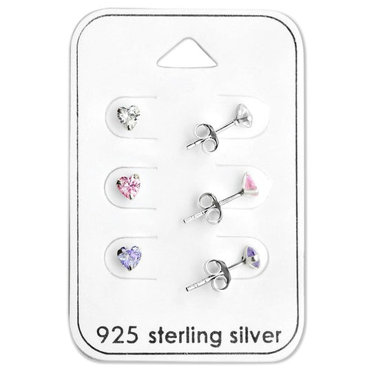 Heart earrings set featuring three pairs of cubic zirconia studs in clear, pink, and lavender on a 925 sterling silver backing.