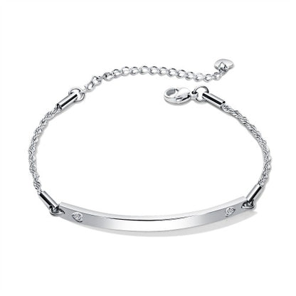 ID bracelet featuring a sleek surgical steel design with cubic zirconia accents and an adjustable chain.