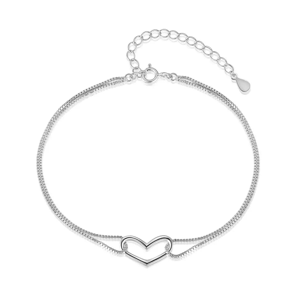 Sterling silver bracelet featuring a double chain design and a simple heart detail, perfect for teens and adults.