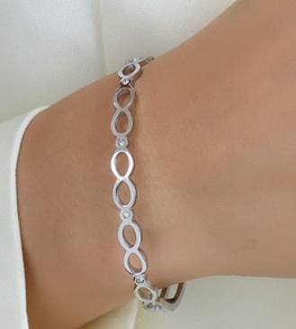 Surgical steel bangle with clear CZ, elegant design perfect for sensitive skin and everyday wear.