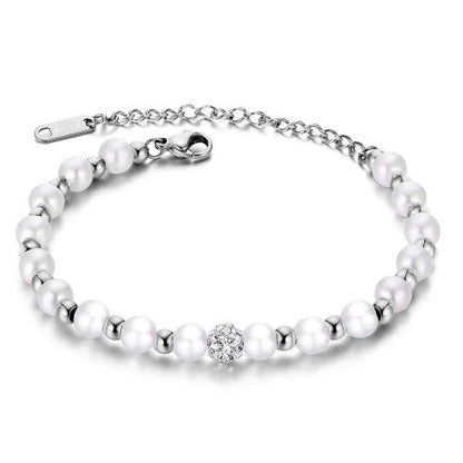 Titanium bracelet featuring pearl beads and a sparkling disco ball bead, adjustable for a perfect fit.