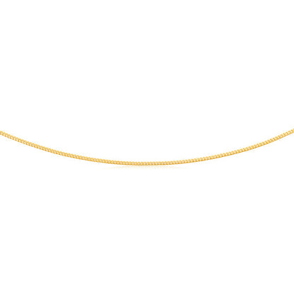 gold plated flat curb chain on a white background