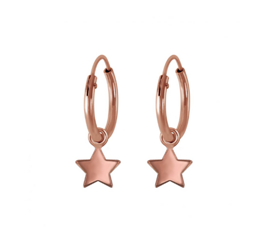 A pair of children's earrings featuring rose gold-colored hoop earrings with flat star dangles.