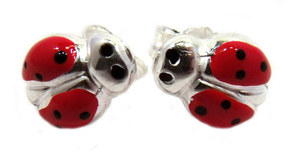 silver lady bug studs with red and black enamel wings and push backs on a white background