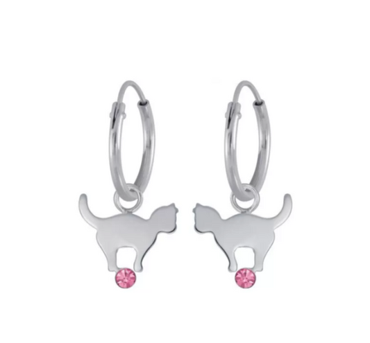 A pair of sterling silver sleepers with cat charms and pink cz on a white background