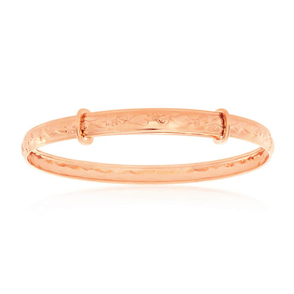 A 9k rose gold adjustable baby bangle with a hearts and roses pattern, presented against a white background.
