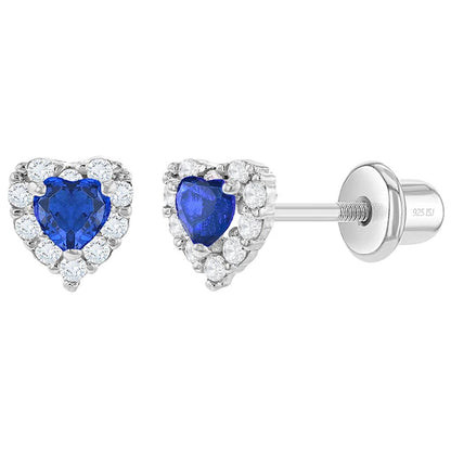 A pair of sterling silver heart earrings with blue and clear cubic zirconia stones and screw back closures for babies and children.