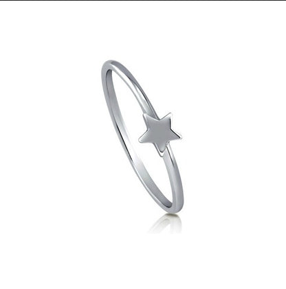 A sterling silver ring with a simple star design, displayed against a white background.